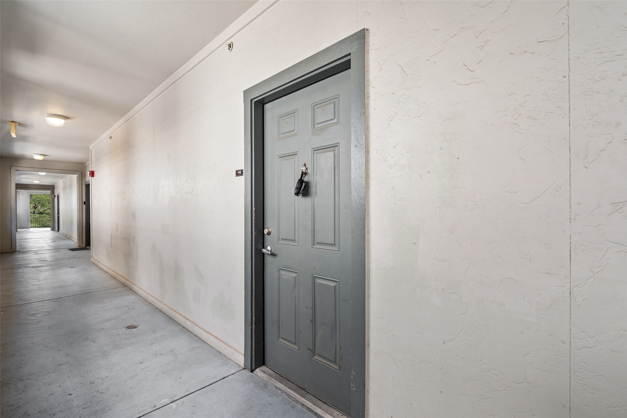 2502 Leon Street, Unit 417 Austin, TX 78705 - Photo 3 of 26 a view of a hallway with wooden floor