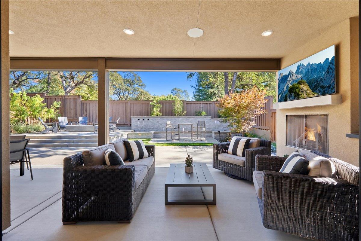 8465 Serene View Road Granite Bay, CA 95746 - Photo 2 of 70 a living room with fireplace furniture and a large window
