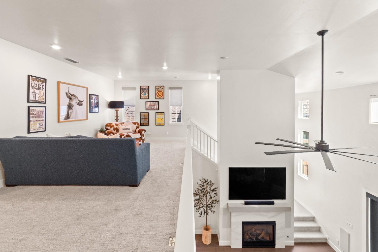 8465 Serene View Road Granite Bay, CA 95746 - Photo 28 of 70 a living room with furniture and a flat screen tv