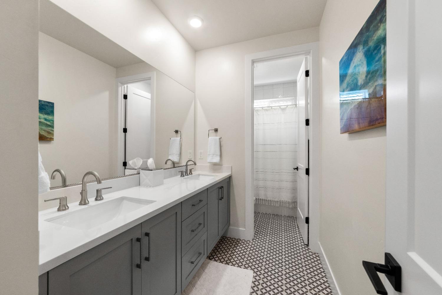 8465 Serene View Road Granite Bay, CA 95746 - Photo 36 of 70 a bathroom with a double vanity sink mirror and double