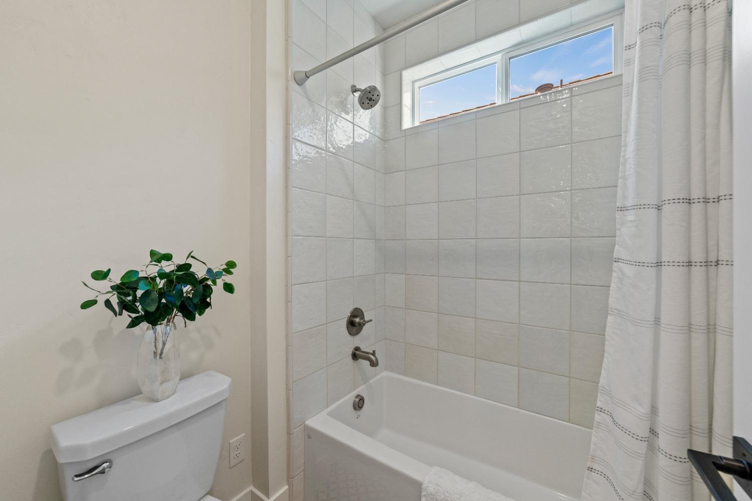 8465 Serene View Road Granite Bay, CA 95746 - Photo 37 of 70 a bathroom with a sink a toilet a bathtub and a shower
