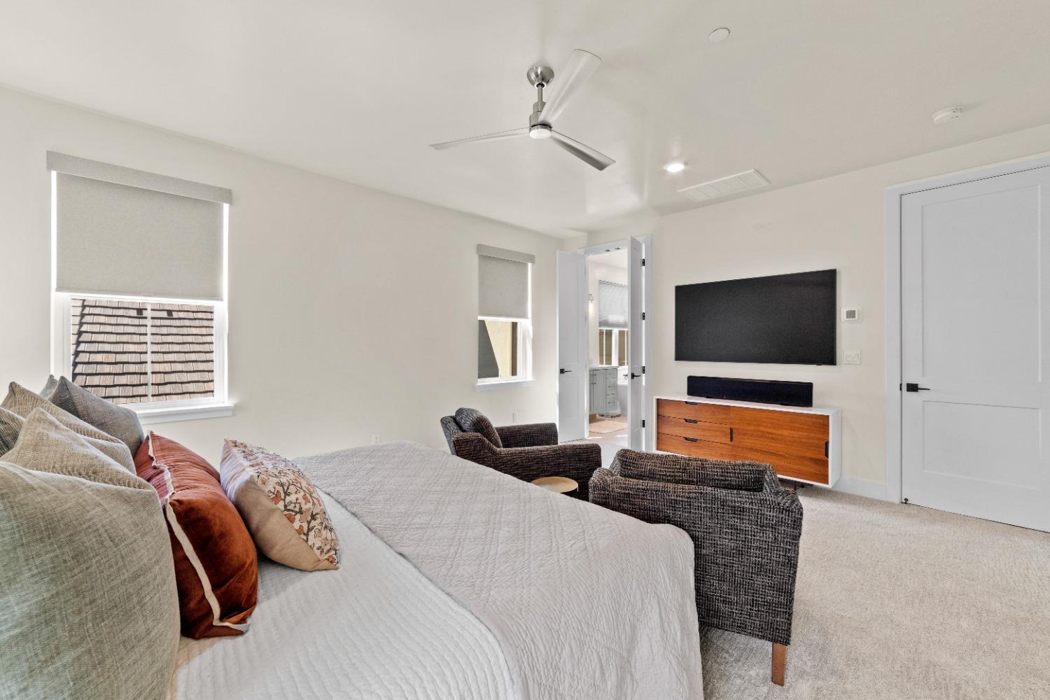 8465 Serene View Road Granite Bay, CA 95746 - Photo 38 of 70 a bedroom with furniture and a flat screen tv