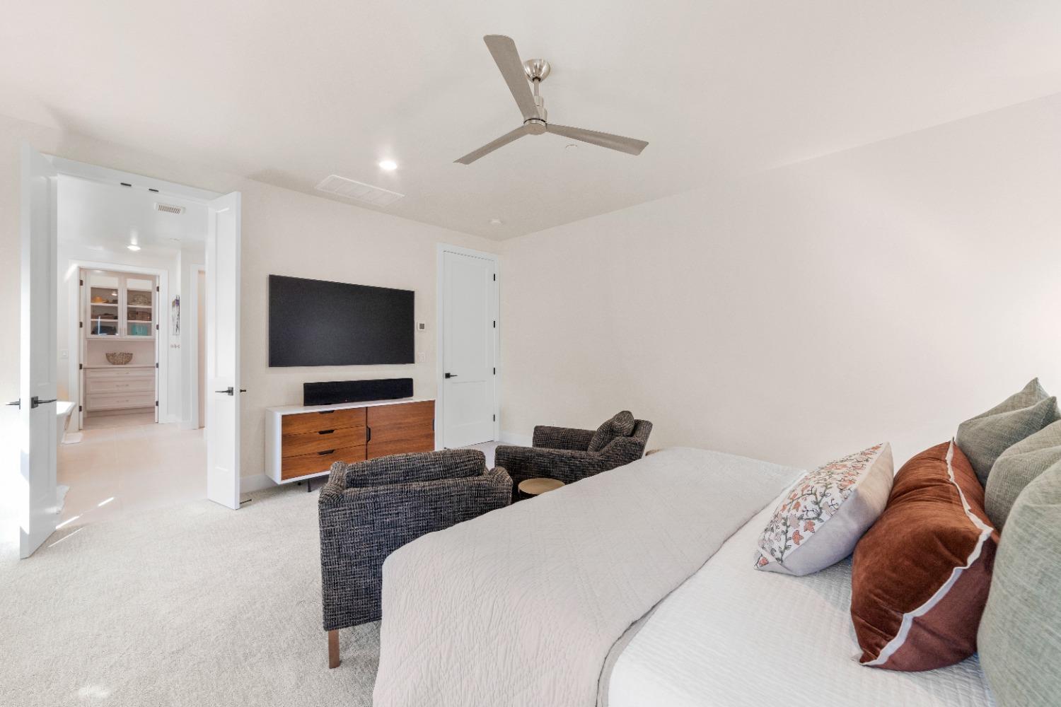 8465 Serene View Road Granite Bay, CA 95746 - Photo 39 of 70 a bedroom with a bed and a flat screen tv