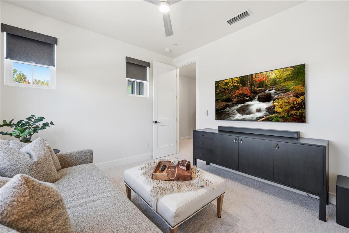 8465 Serene View Road Granite Bay, CA 95746 - Photo 49 of 70 a living room with furniture and a flat screen tv