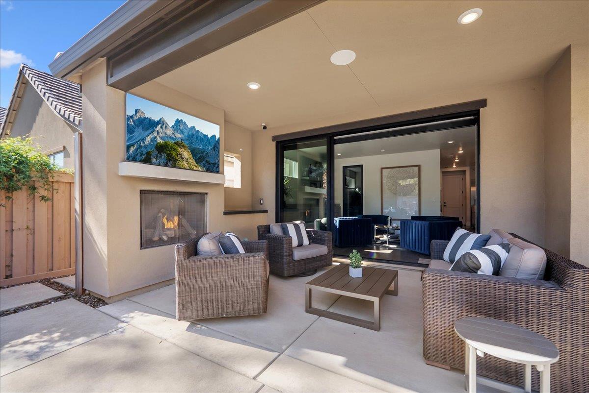 8465 Serene View Road Granite Bay, CA 95746 - Photo 56 of 70 a living room with furniture and a fireplace