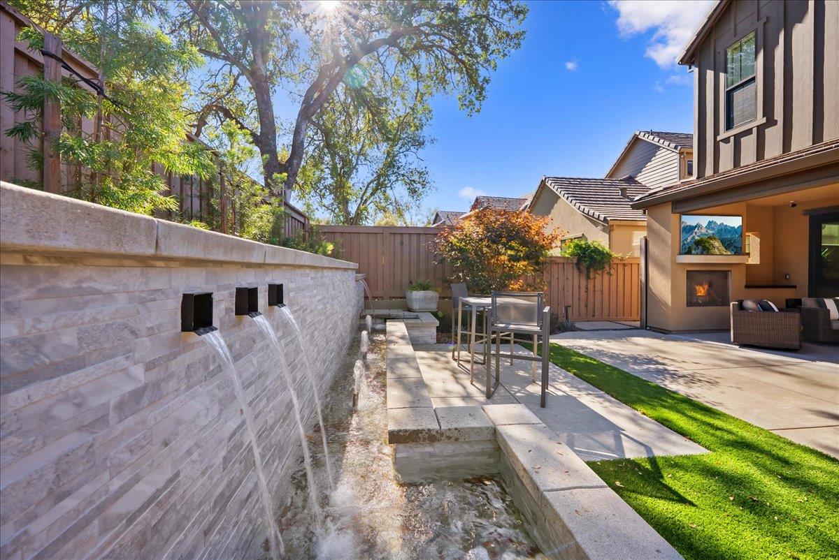 8465 Serene View Road Granite Bay, CA 95746 - Photo 60 of 70 a view of a patio with table and chairs with wooden floor and fence