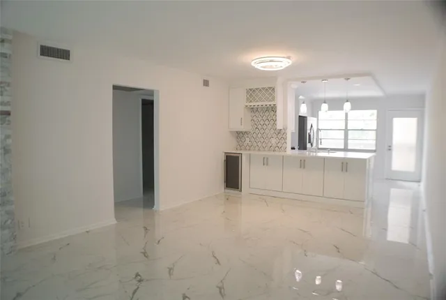 a view of a kitchen with granite countertop cabinets and a sink