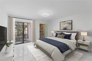 a spacious bedroom with a large bed and a flat screen tv