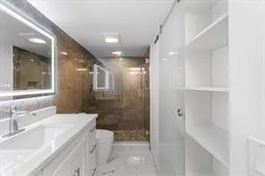 a bathroom with a bathtub shower sink and toilet