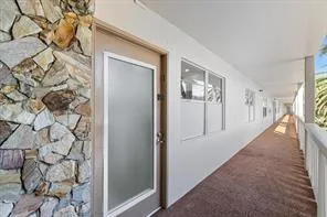 an aerial view of residential building and lake