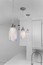 a view of a chandelier fan and wooden floor