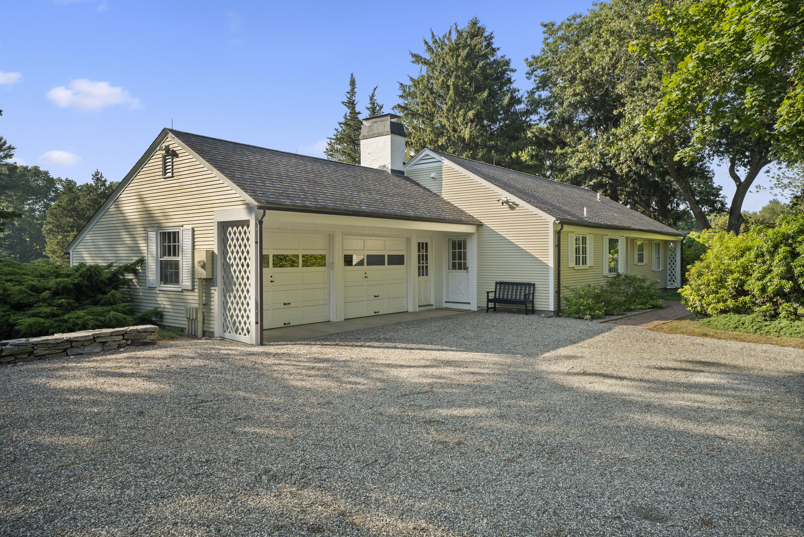 455 Stonington Road Stonington, CT 06378 - Photo 25 of 39 a front view of a house with a garden