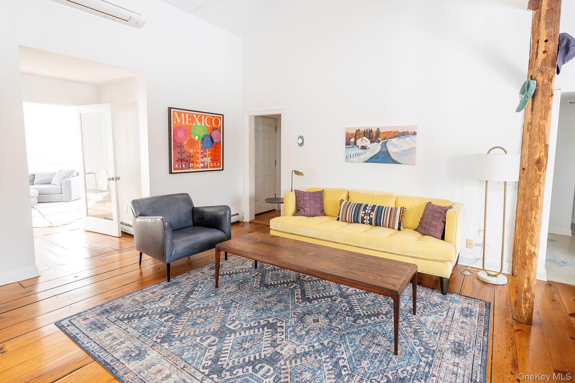 692 Bangall Road Millbrook, NY 12545 - Photo 12 of 30 a living room with furniture and a rug