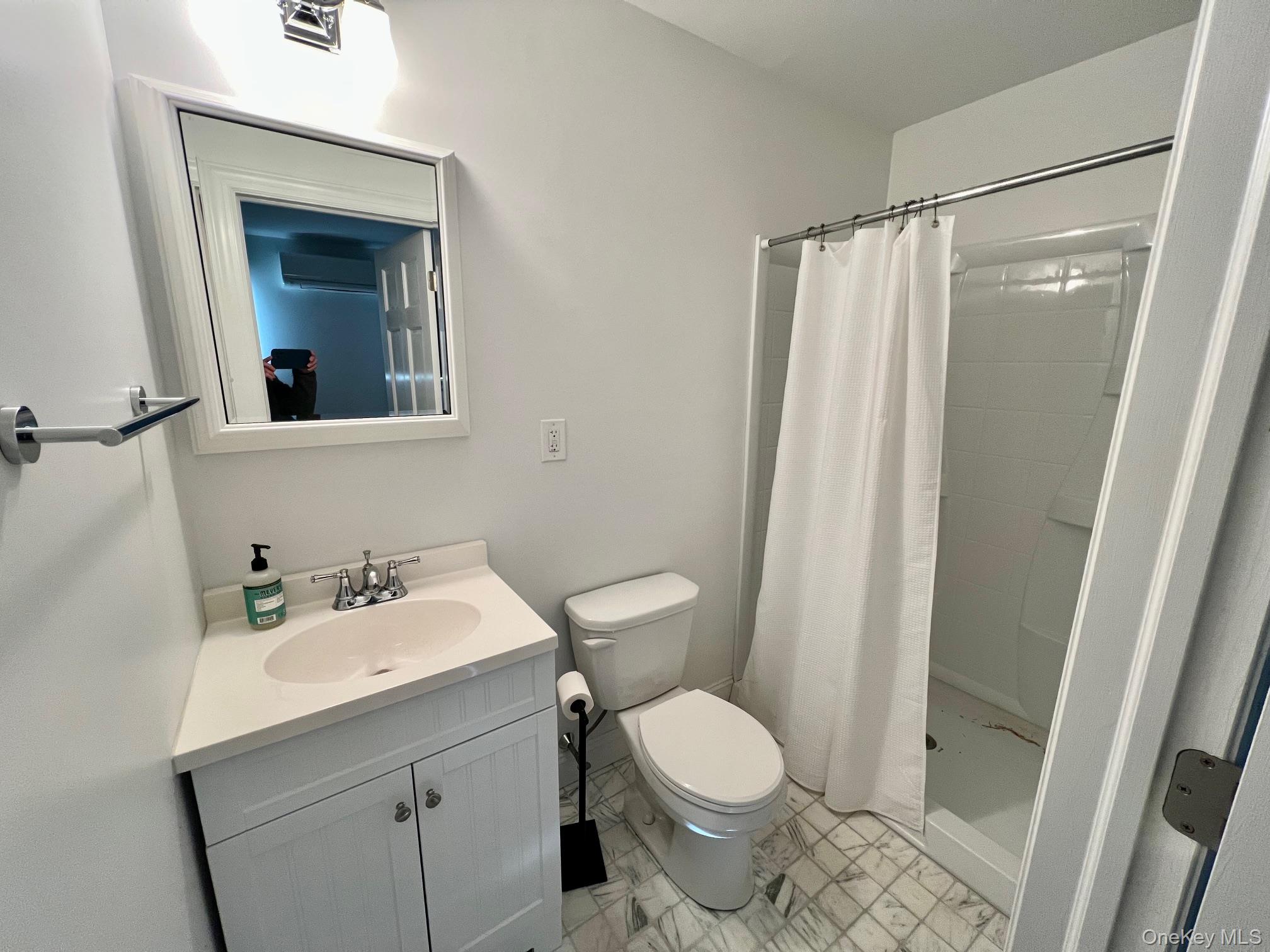 692 Bangall Road Millbrook, NY 12545 - Photo 21 of 30 a bathroom with a sink and a mirror