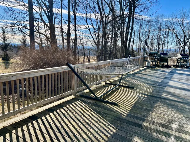 a view of a chairs and table on the deck