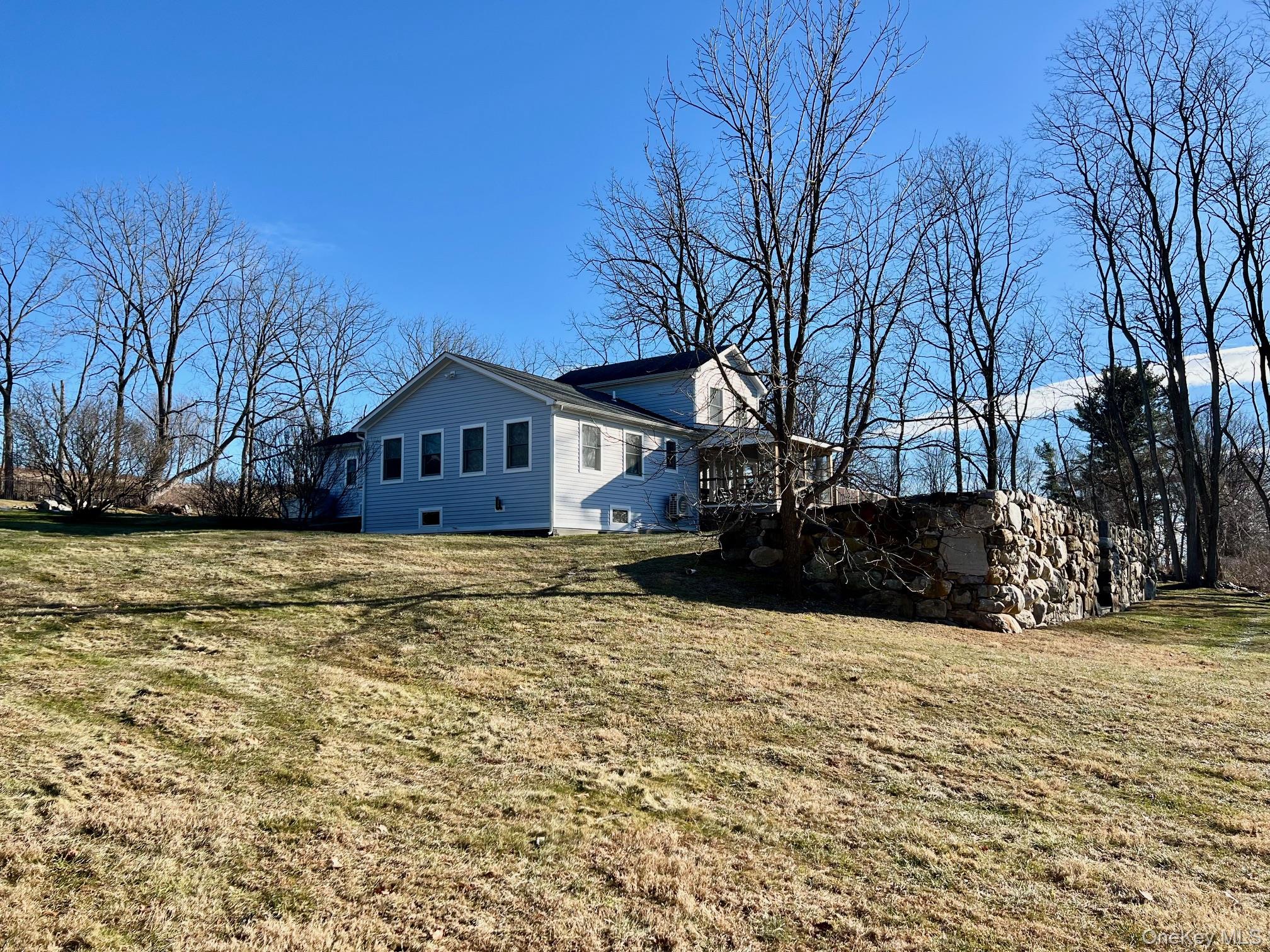 692 Bangall Road Millbrook, NY 12545 - Photo 3 of 30 a house view with wooden fence in front of house