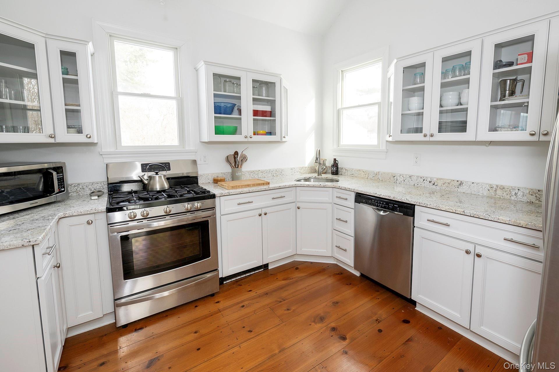 692 Bangall Road Millbrook, NY 12545 - Photo 6 of 30 a kitchen with a stove sink and cabinets