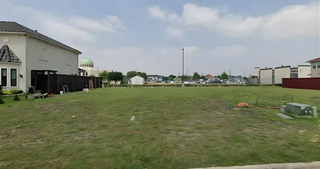 a view of a terrace with chairs and garden