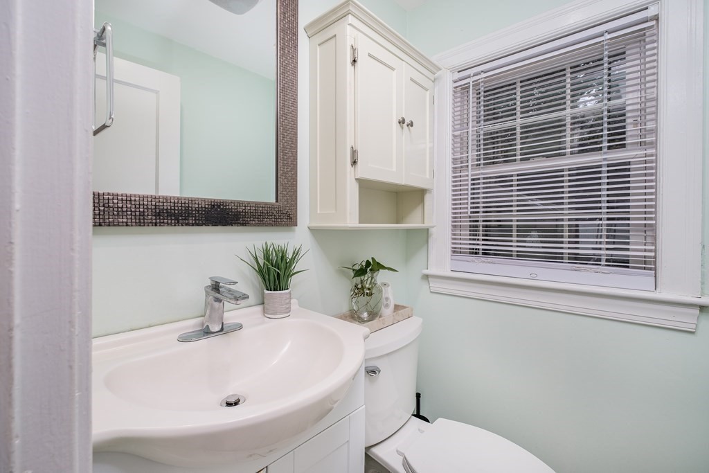 32 Tufts Road Winchester, MA 01890 - Photo 14 of 24 a bathroom with a sink a toilet and shower