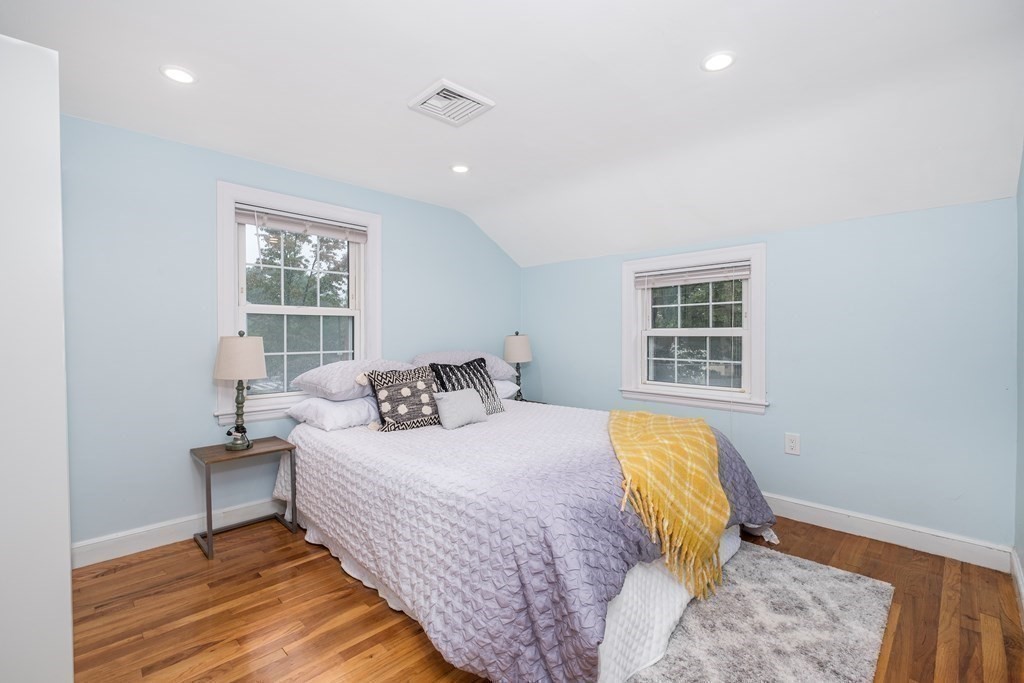 32 Tufts Road Winchester, MA 01890 - Photo 16 of 24 a bedroom with a bed and wooden floor