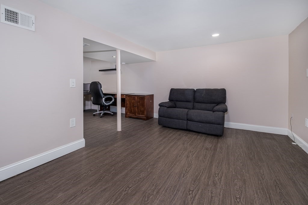 32 Tufts Road Winchester, MA 01890 - Photo 19 of 24 a living room with furniture and a wooden floor