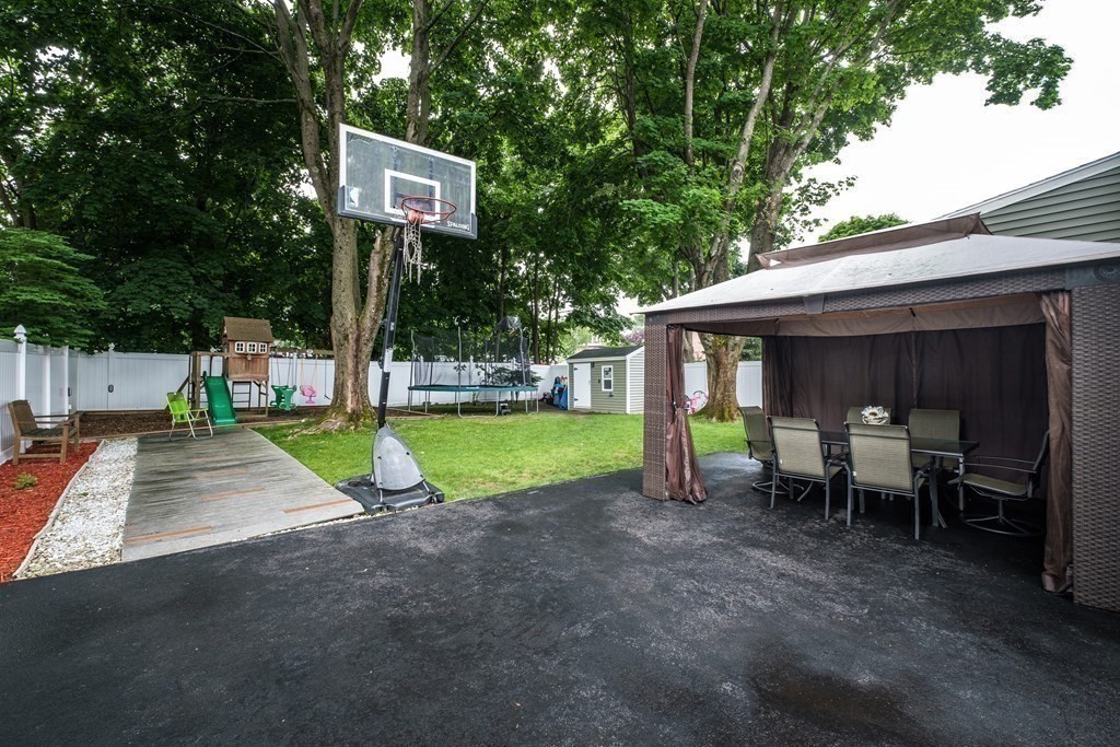 32 Tufts Road Winchester, MA 01890 - Photo 20 of 24 a view of a house with backyard and porch