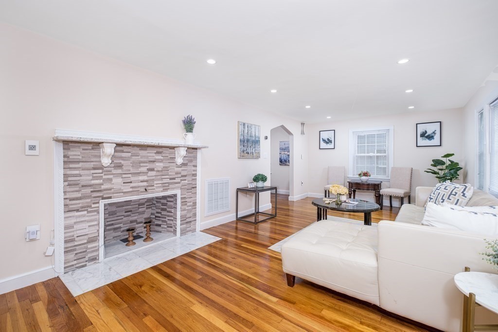 32 Tufts Road Winchester, MA 01890 - Photo 3 of 24 a living room with furniture and a fireplace