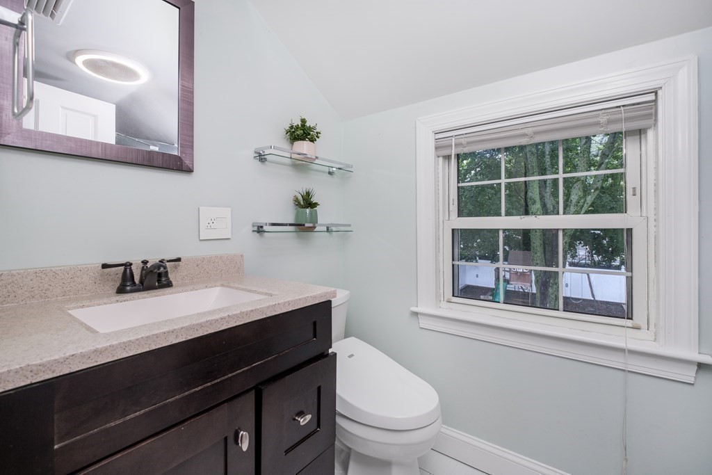 32 Tufts Road Winchester, MA 01890 - Photo 9 of 24 a bathroom with a sink a toilet and a window