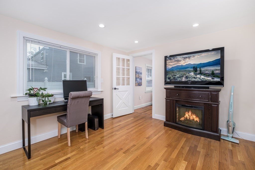 32 Tufts Road Winchester, MA 01890 - Photo 10 of 24 a living room with furniture and a fireplace