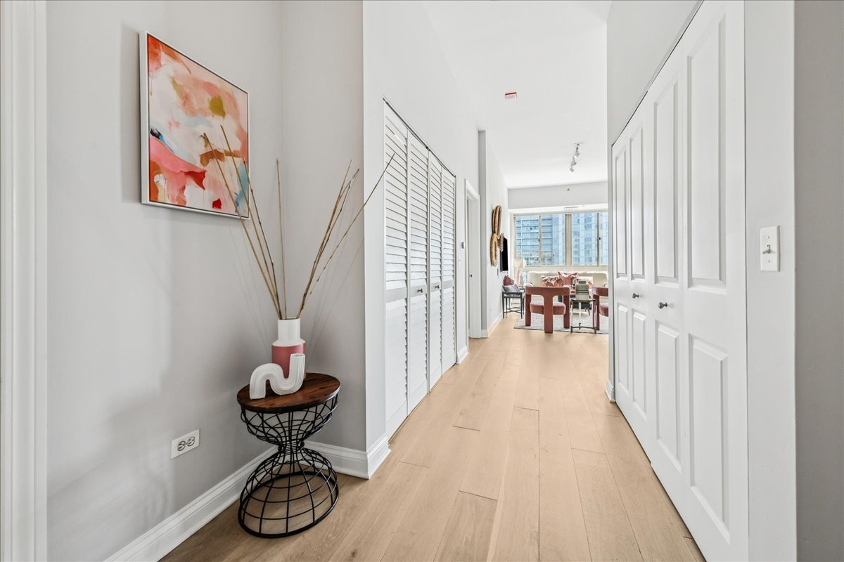 230 West Division Street, Unit 1202 Chicago, IL 60610 - Photo 2 of 20 a view of entryway and hall with wooden floor