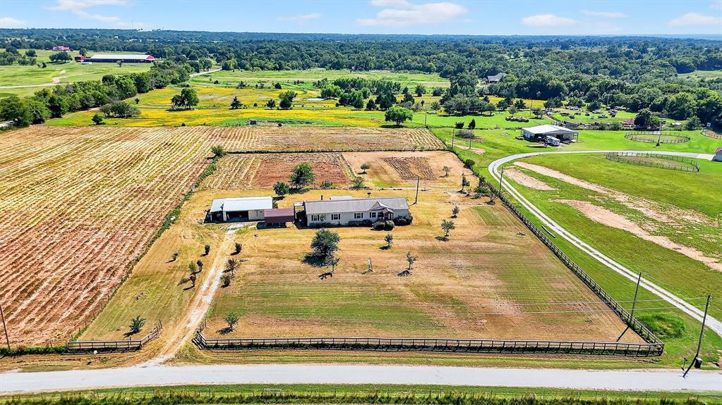 12085 Keys Road Marietta, OK 73448 - Photo 2 of 40 a view of a swimming pool with a yard and seating area