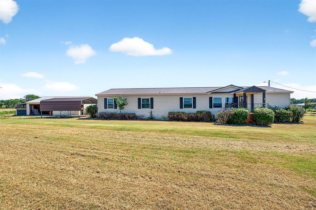12085 Keys Road Marietta, OK 73448 - Photo 21 of 40 a front view of a house with a garden