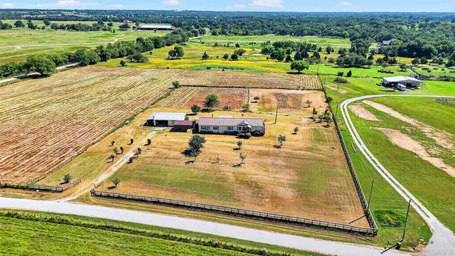 swimming pool view with a garden and ocean view