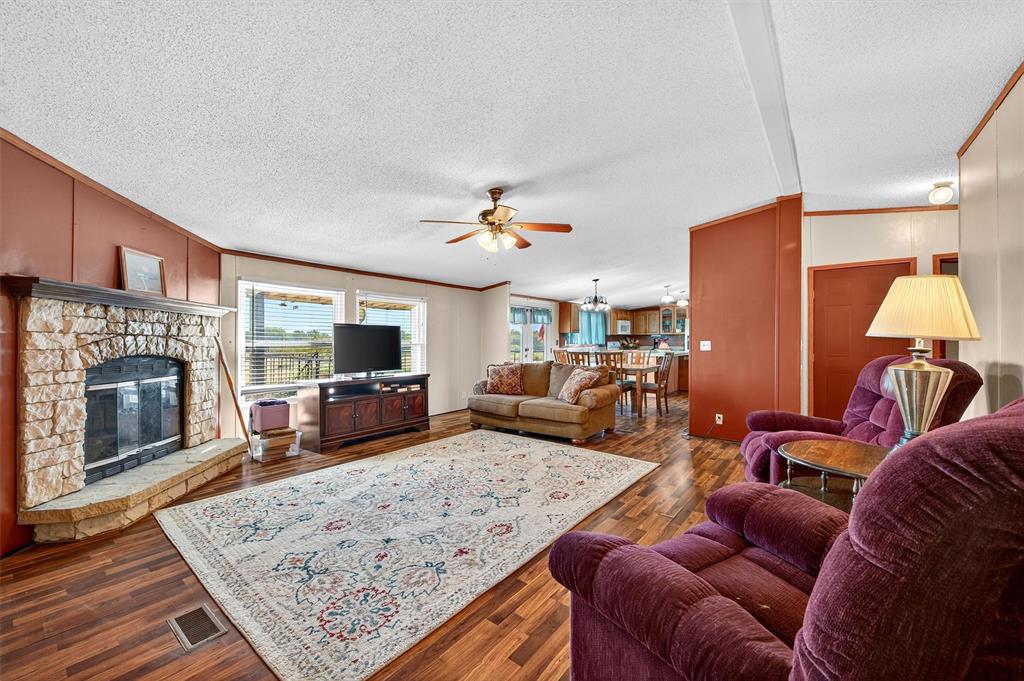 12085 Keys Road Marietta, OK 73448 - Photo 32 of 40 a living room with furniture and a fireplace