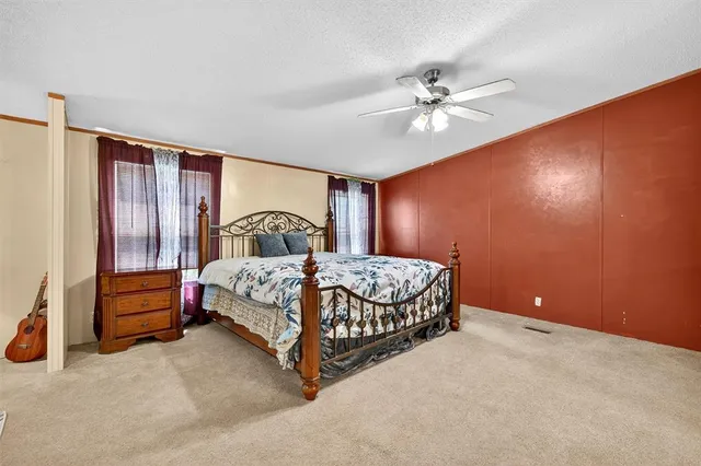 a bedroom with furniture and a window