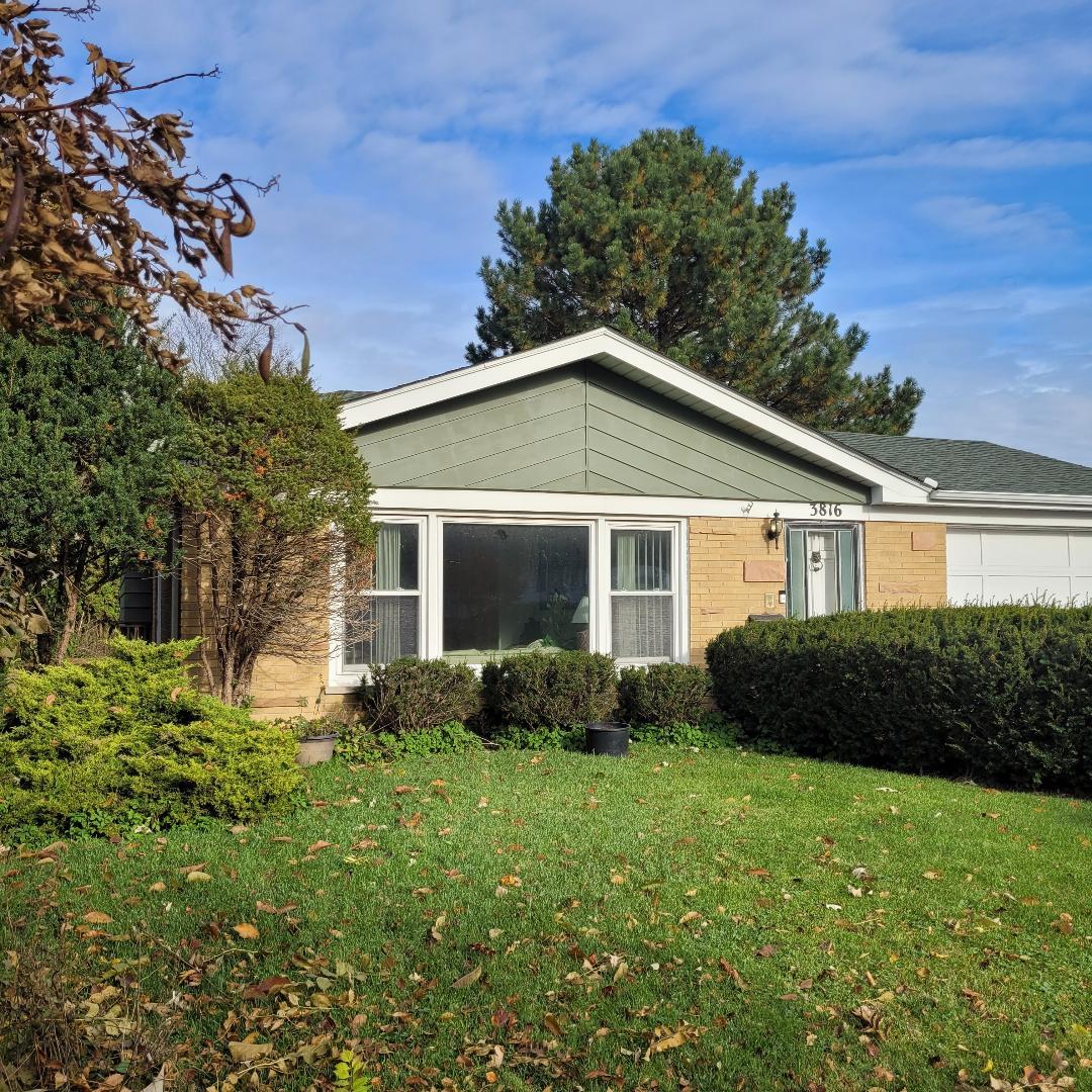 3816 Rugen Road Glenview, IL 60025 - Photo 1 of 1 a front view of a house with a yard