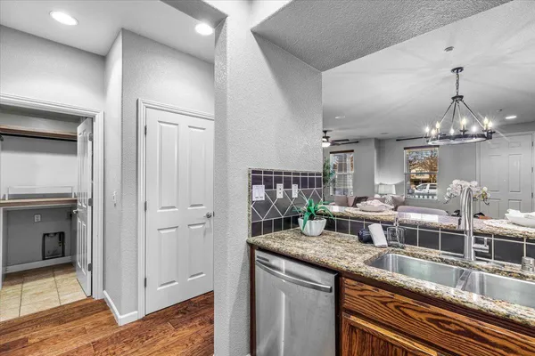 a kitchen with a counter space cabinets and appliances