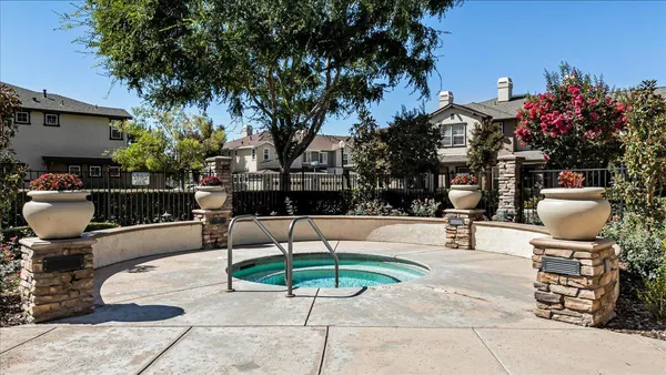 a view of a backyard with sitting area