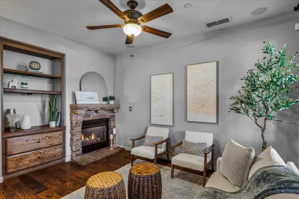 a living room with furniture and a fireplace