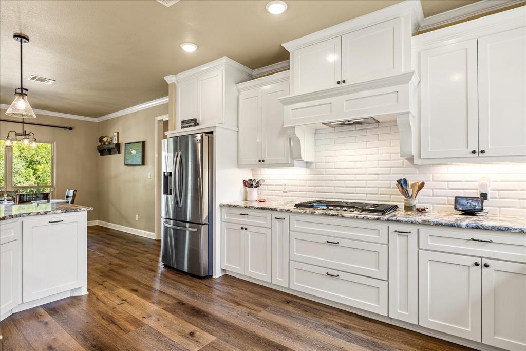 3868 Legend Trail Granbury, TX 76049 - Photo 11 of 39 Tons of storage and counter space. LVP flooring makes for comfort and easy cleaning.