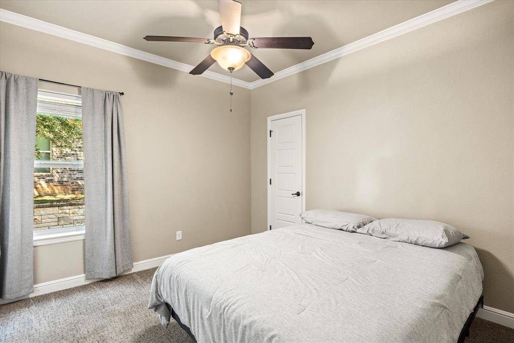 3868 Legend Trail Granbury, TX 76049 - Photo 27 of 39 Secondary bedroom with large walk in closet.