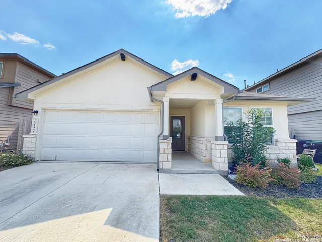 a front view of a house with garage