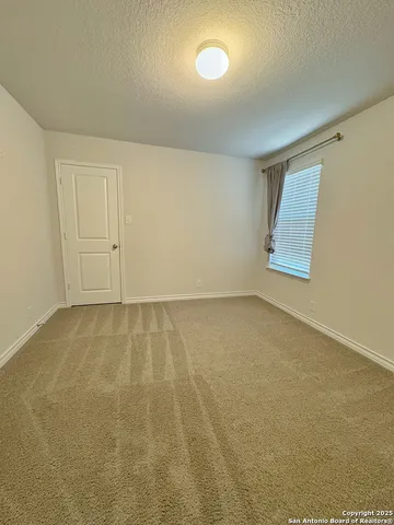 an empty room with a empty space and window