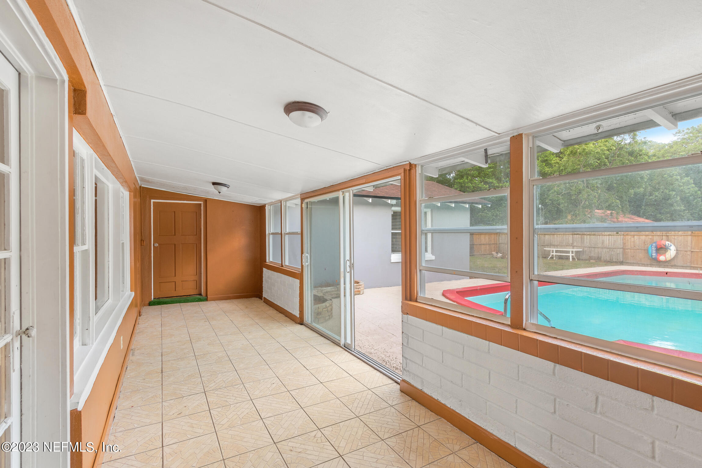665 Lee Road Jacksonville, FL 32225 - Photo 30 of 58 a view of an entryway with wooden floor and windows