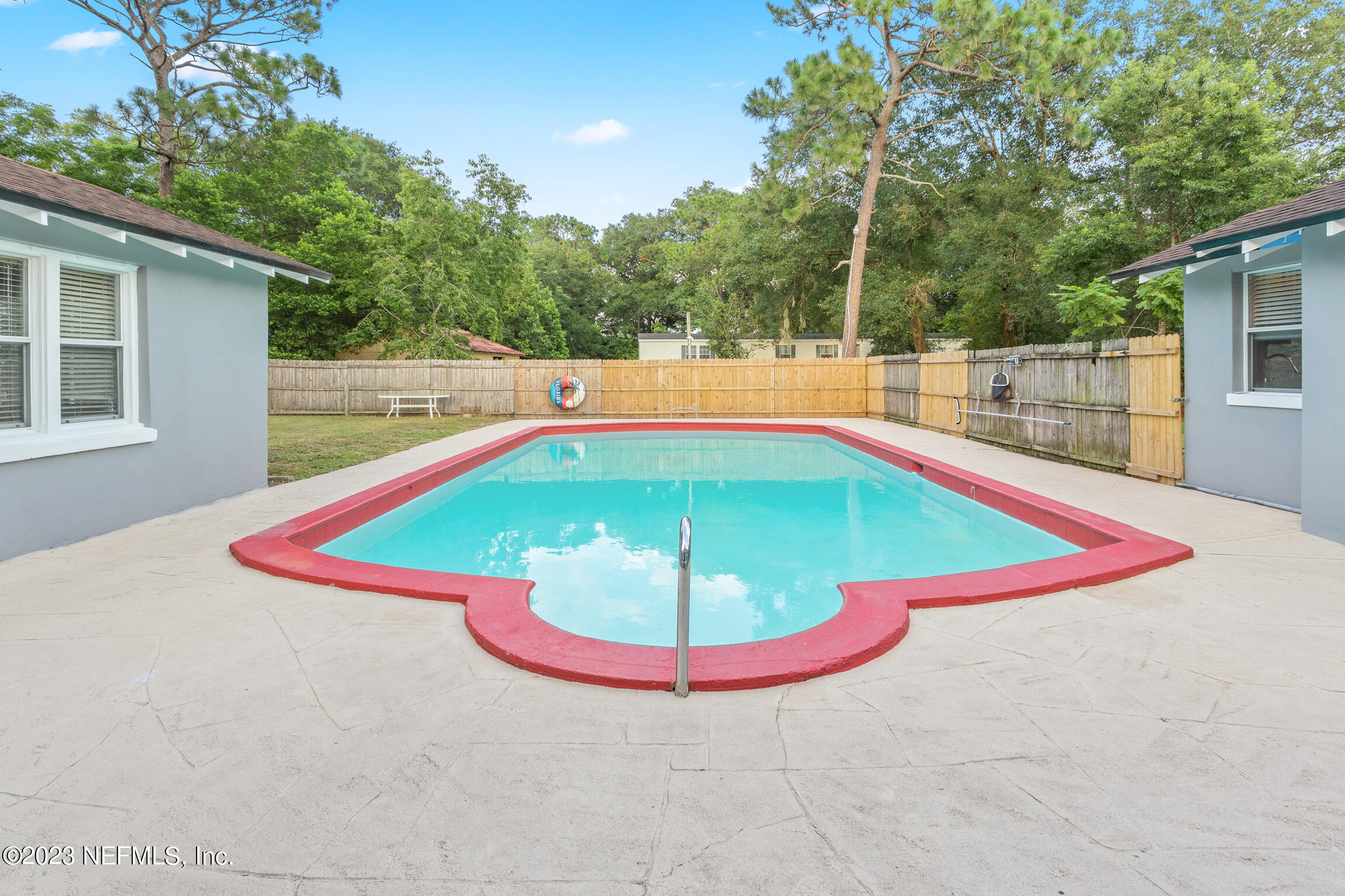 665 Lee Road Jacksonville, FL 32225 - Photo 31 of 58 a view of a swimming pool with an outdoor space
