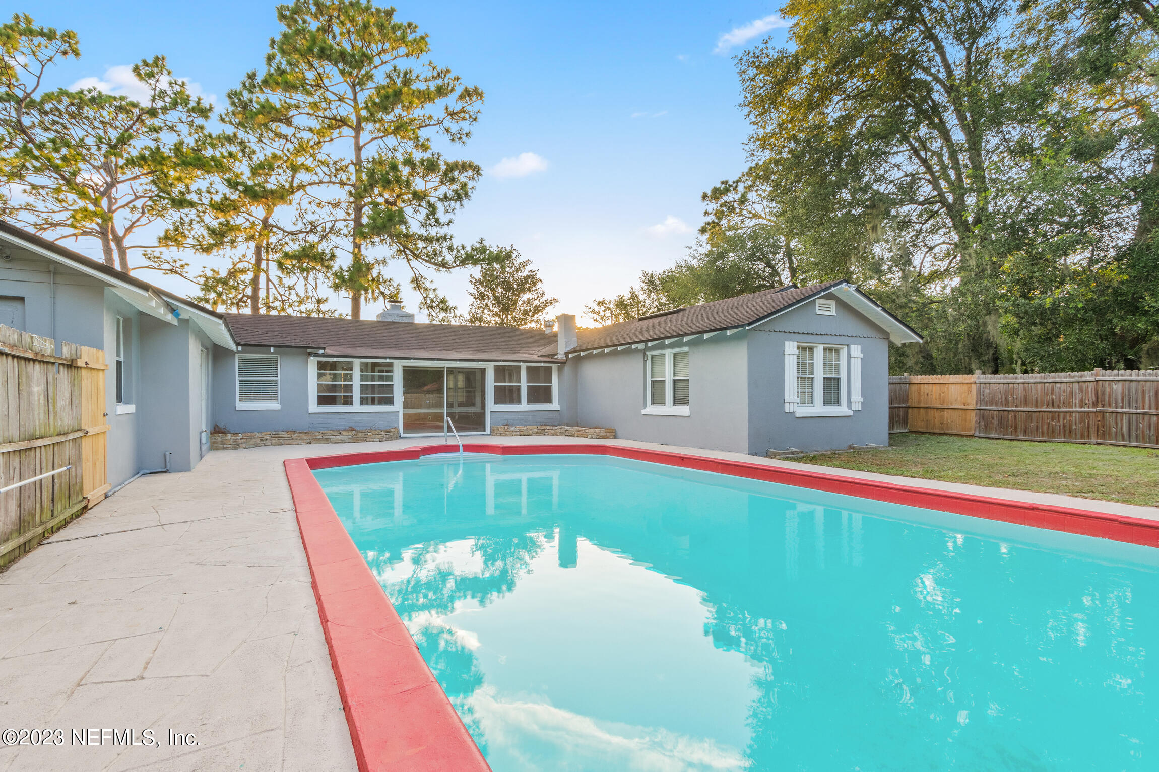 665 Lee Road Jacksonville, FL 32225 - Photo 32 of 58 a house with swimming pool in front of it