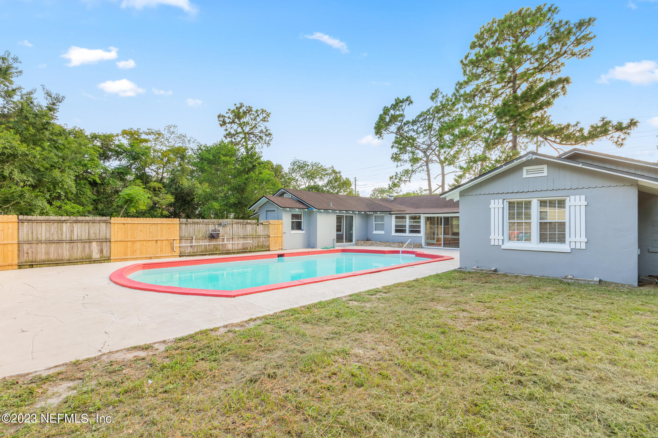 665 Lee Road Jacksonville, FL 32225 - Photo 33 of 58 a house with swimming pool in front of it