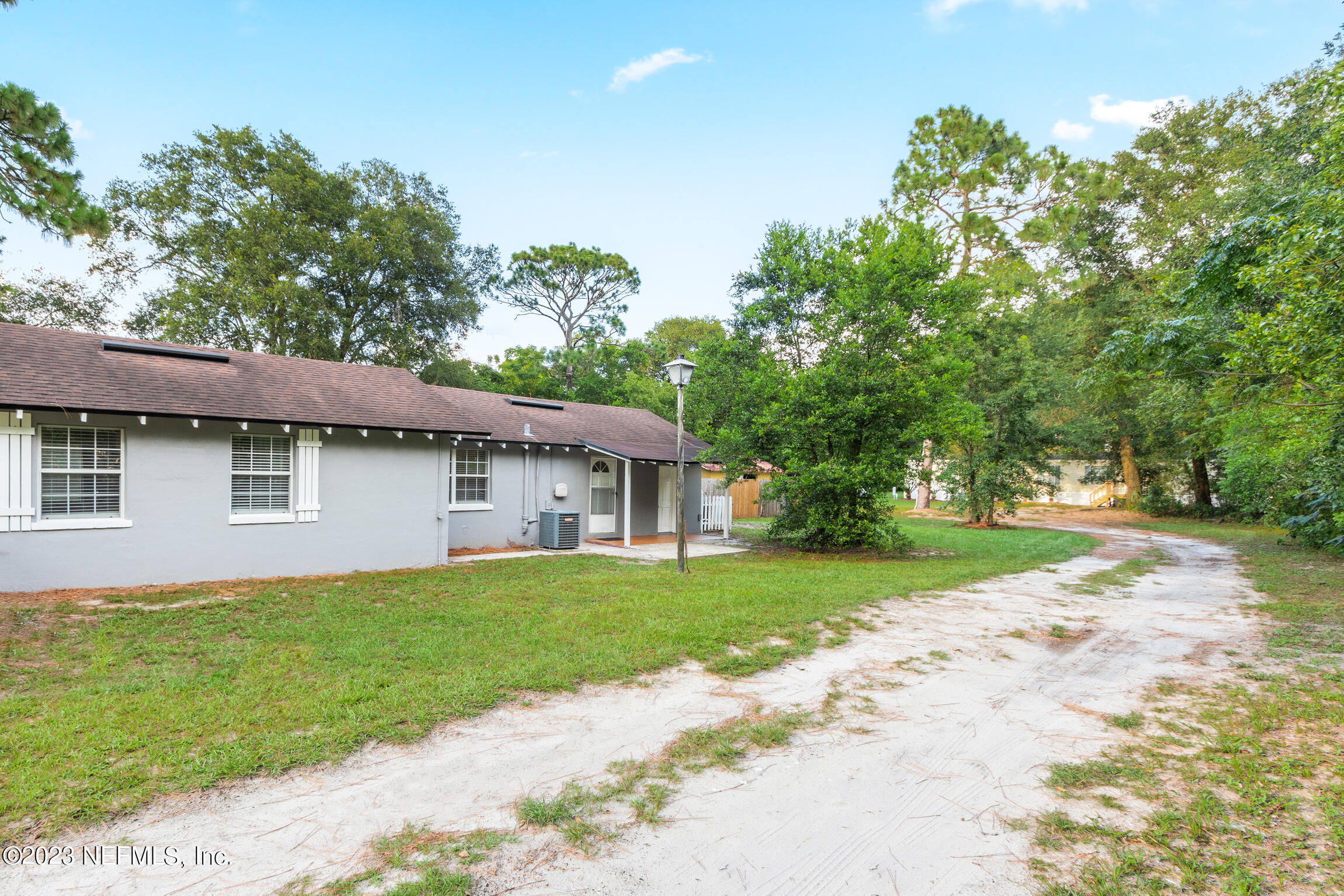 665 Lee Road Jacksonville, FL 32225 - Photo 35 of 58 a front view of a house with a garden