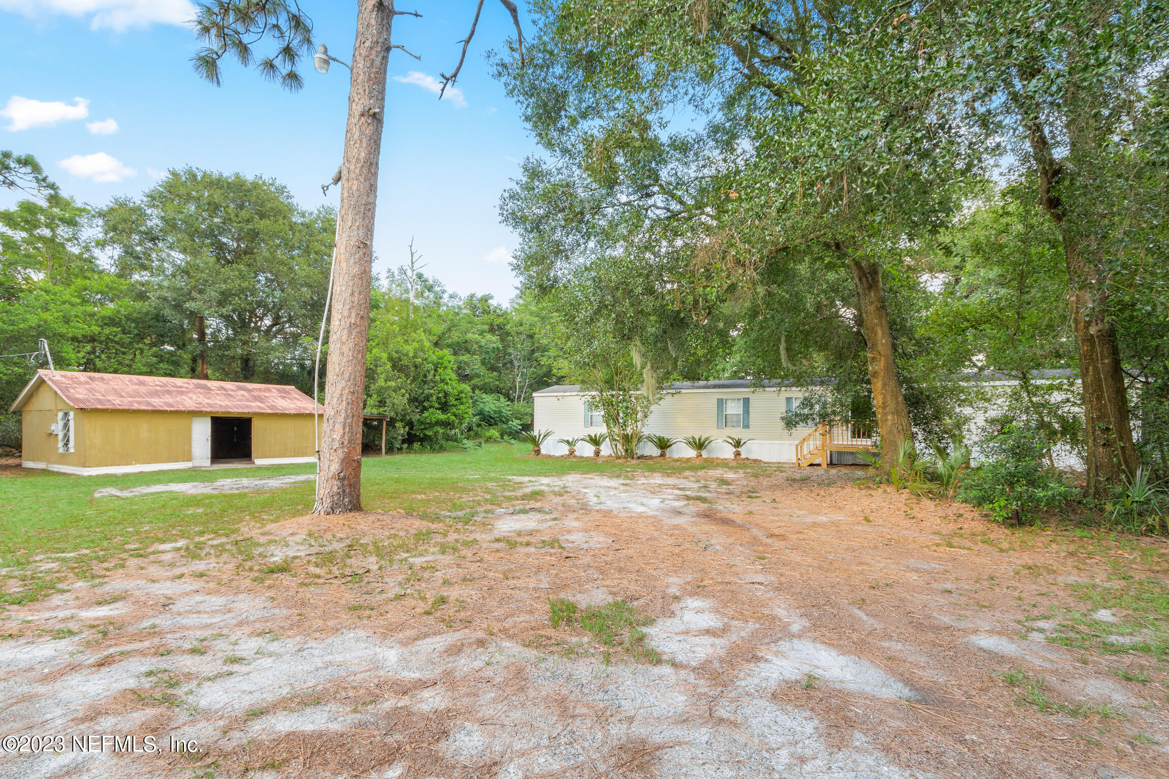 665 Lee Road Jacksonville, FL 32225 - Photo 36 of 58 a house with trees in front of it