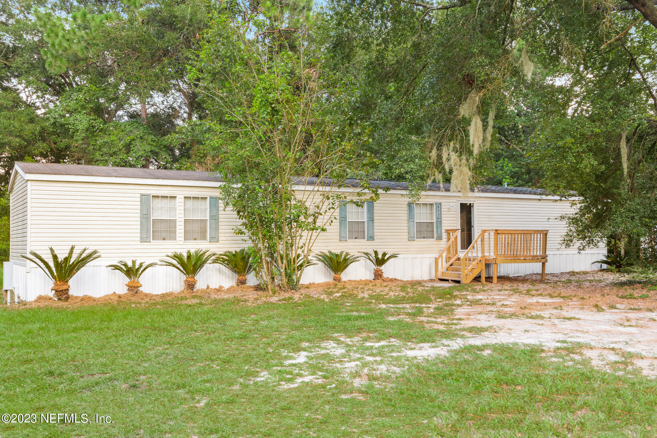 665 Lee Road Jacksonville, FL 32225 - Photo 37 of 58 a view of a house with backyard and sitting area